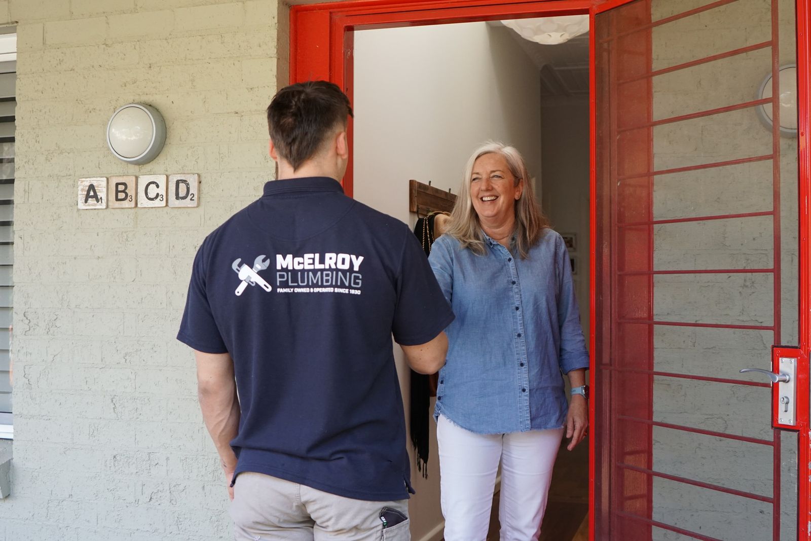 McElroy plumber arriving at a unit and being let in by the owner