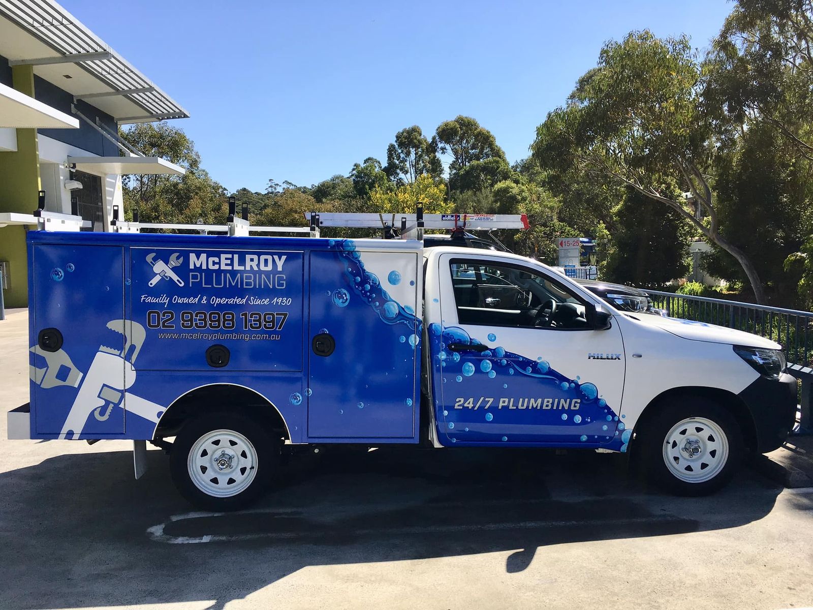 McElroy Plumbing ute with the blue and white signwriting