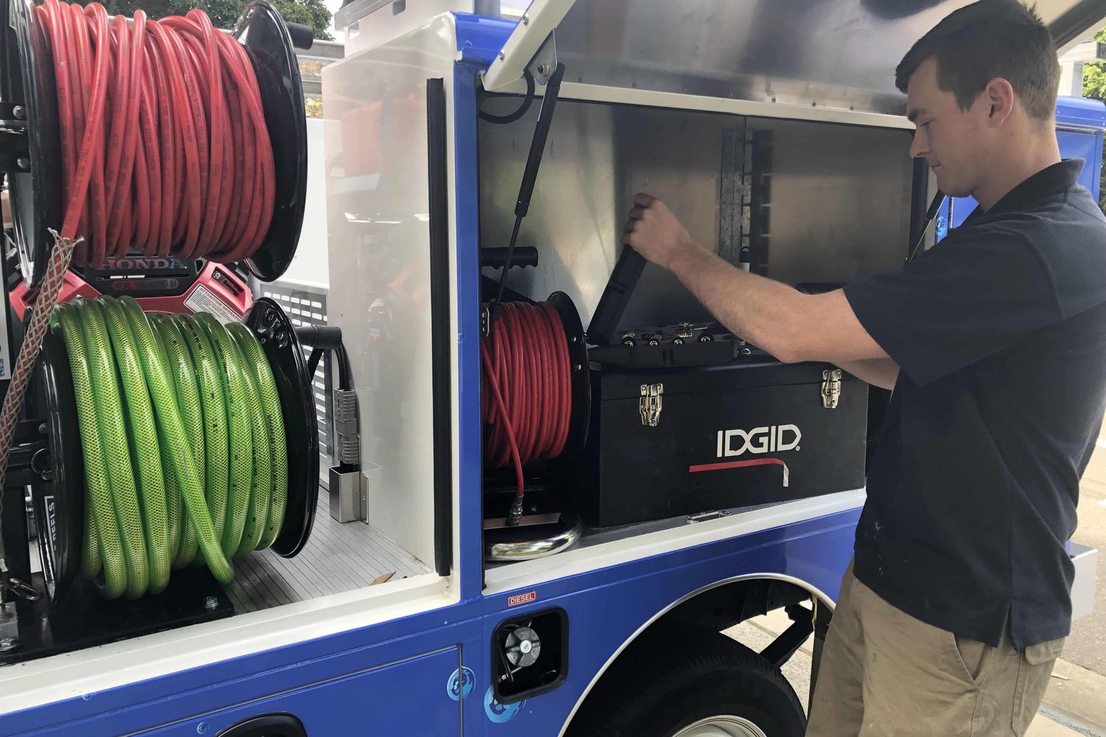 Back of a McElroy van with the drain jetter hose reels